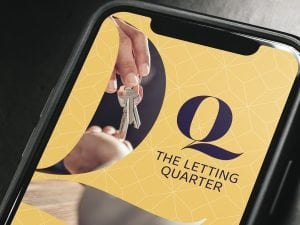 A mobile phone displaying The Letting Quarter website on the screen